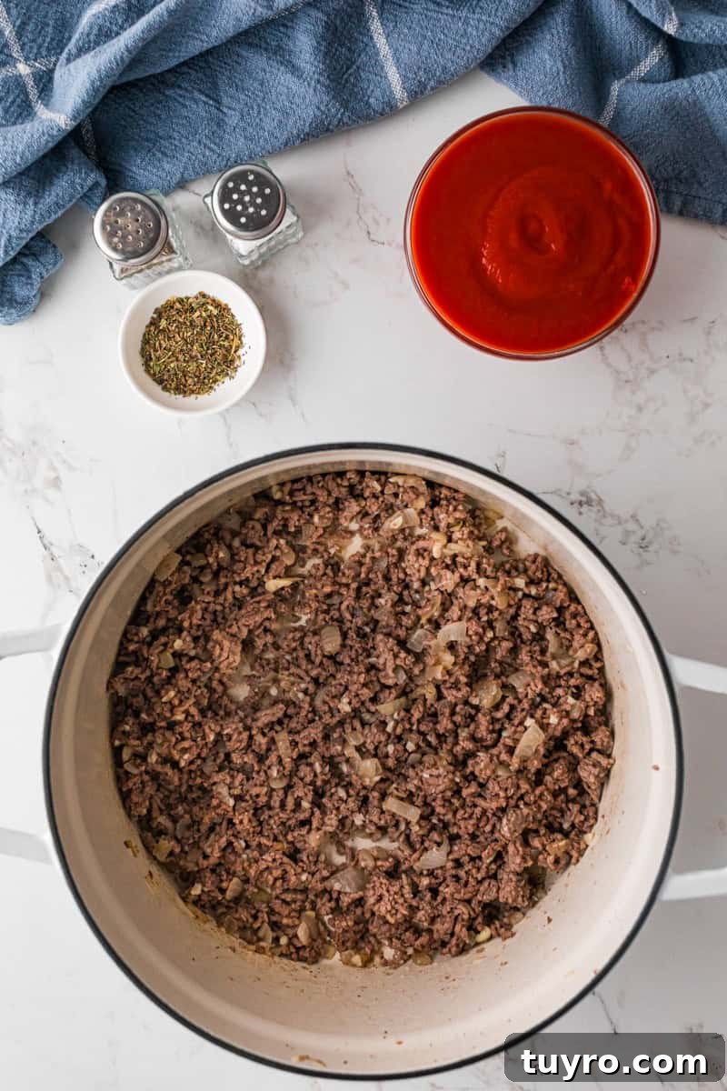 Homemade Beefaroni: Savory One-Pot Pasta Recipe 6 cooking the ground beef.