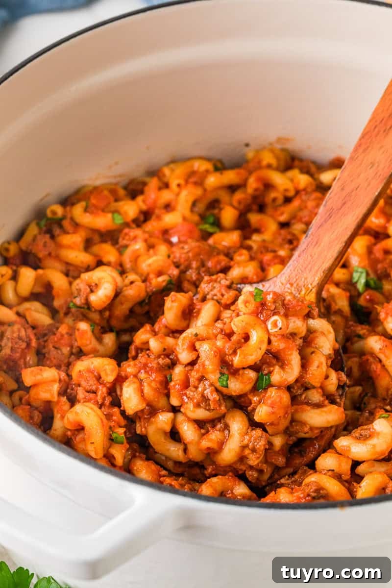 Homemade Beefaroni: Savory One-Pot Pasta Recipe 9 closeup of the Beefaroni being served out of the pot.