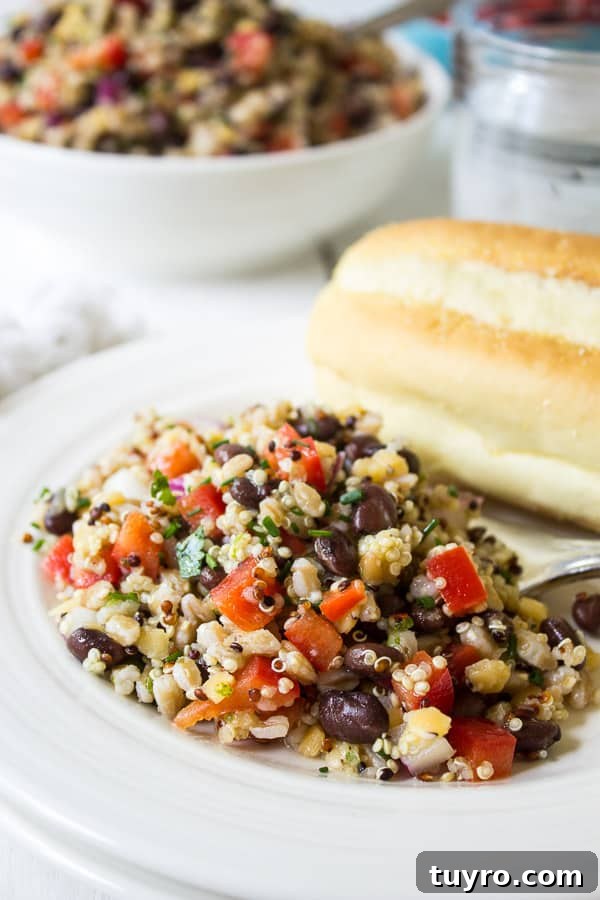 Farro mixed with quinoa, tomatoes, black beans and fresh herbs.