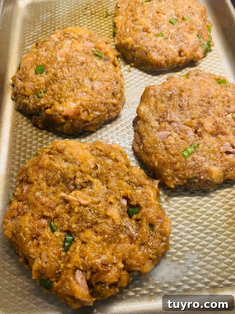 salmon patties on a tray before cooking
