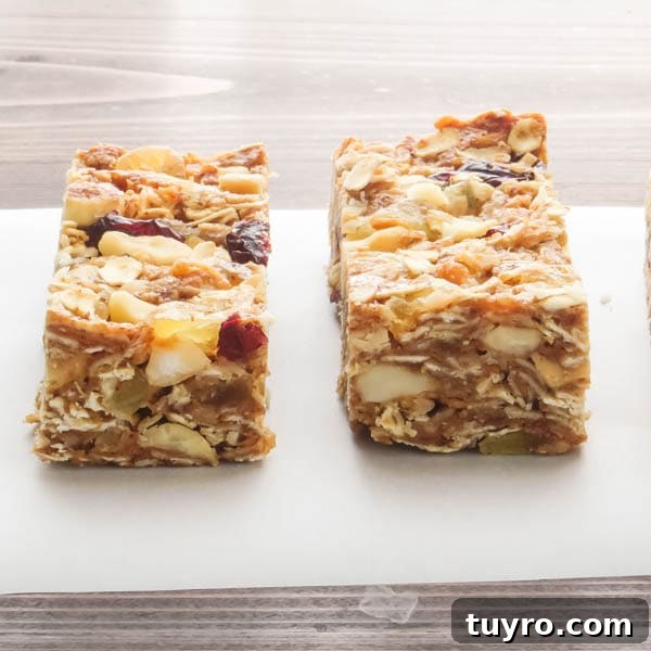 Pineapple Macadamia Granola Bars Recipe 8 Pineapple Macadamia Granola Bars on parchment.
