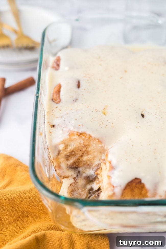 30-Minute Homemade Cinnamon Rolls 8 homemade cinnamon rolls with cream cheese icing in a baking dish