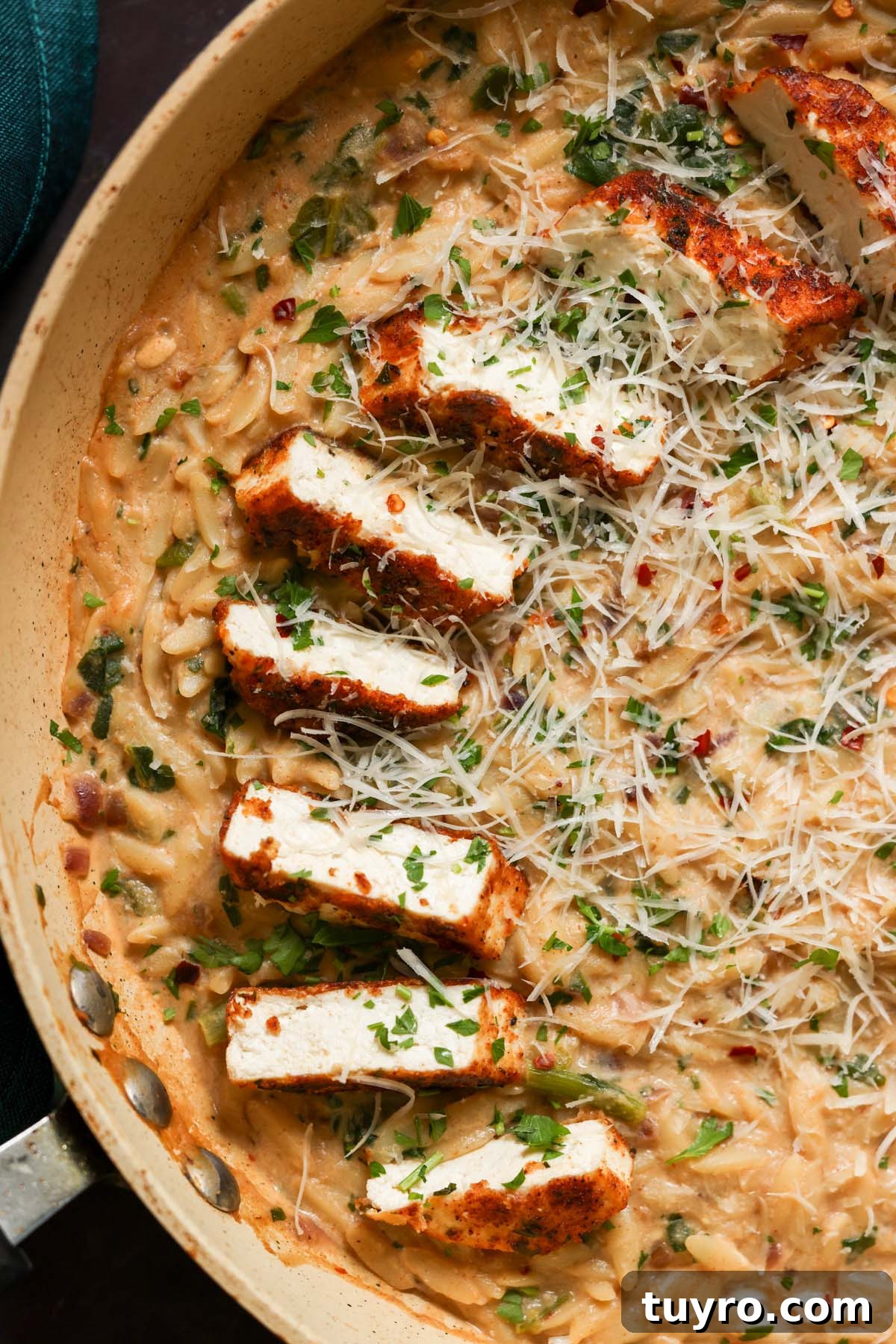 Garlic Parmesan Orzo with Pan-Seared Paprika Tofu 2 close-up of garlic parmesan orzo in the pan with the crispy tofu