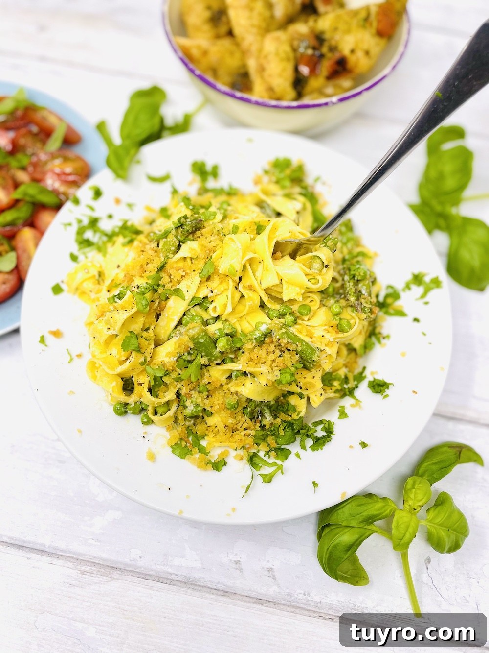 4-Week Weekly Meal Plan: Simple Dinners and Grocery List 3 fork being twirled into creamy asparagus pasta with garlicky breadcrumbs
