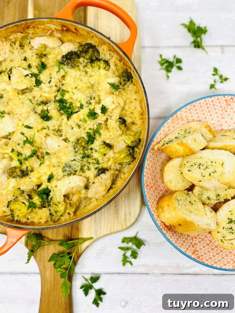 4-Week Weekly Meal Plan: Simple Dinners and Grocery List 5 Image shows a pan of chicken and rice casserole next to a bowl of sliced garlic bread