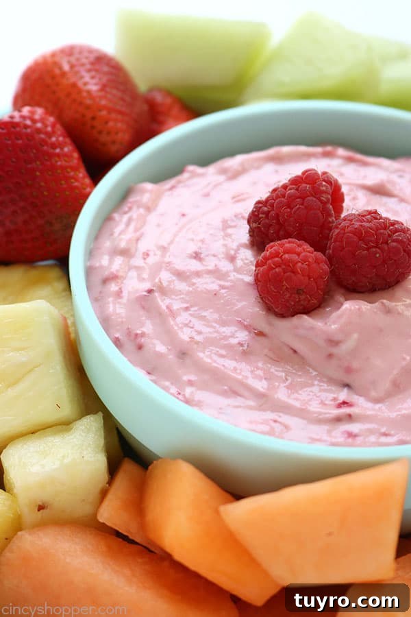 Creamy Raspberry Fruit Dip Recipe for Parties and Snacks 3 Raspberry Fruit Dip - Just 4 ingredients are needed and it is so super simple to make. Great for a summer potluck addition. #FruitDip