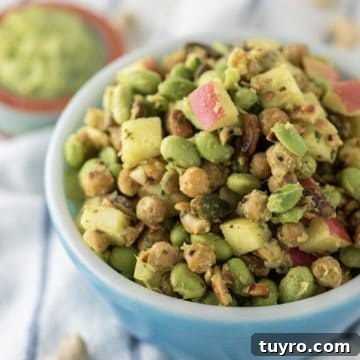 Edamame Salad with Sesame Ginger Dressing 6 Edamame salad in blue bowl with side of avocado dressing.