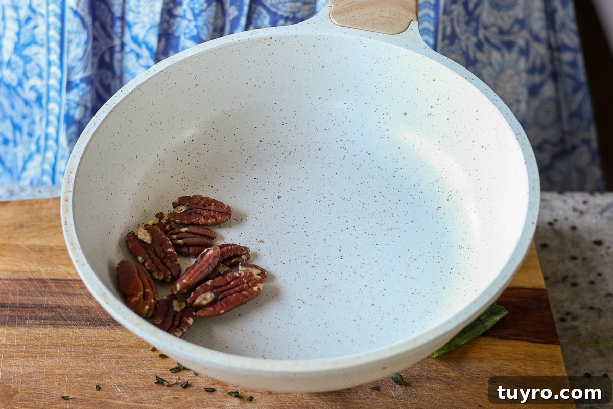 Festive Vegan Cheese Log Recipe for Holiday Parties 8 toasting the pecans
