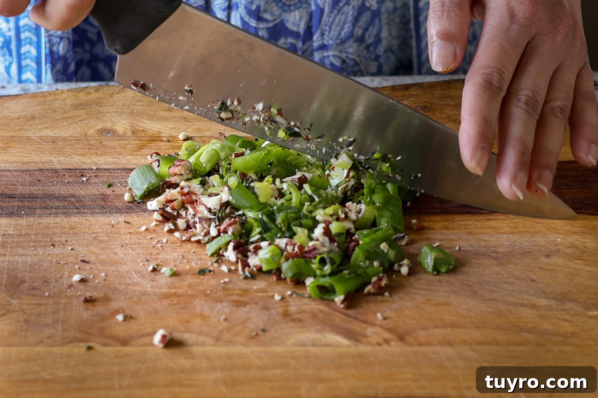 Festive Vegan Cheese Log Recipe for Holiday Parties 9 chopping up the toppings ingredients