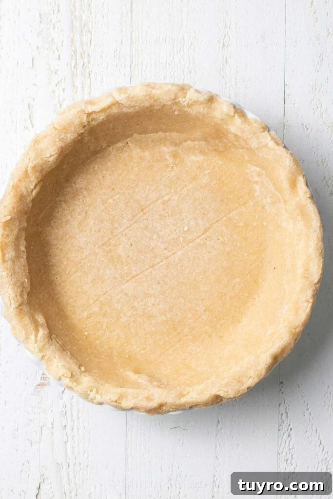 Flaky Almond Flour Pie Crust Recipe for Perfect Pastries 10 A prebaked almond flour pie crust ready for a filling.