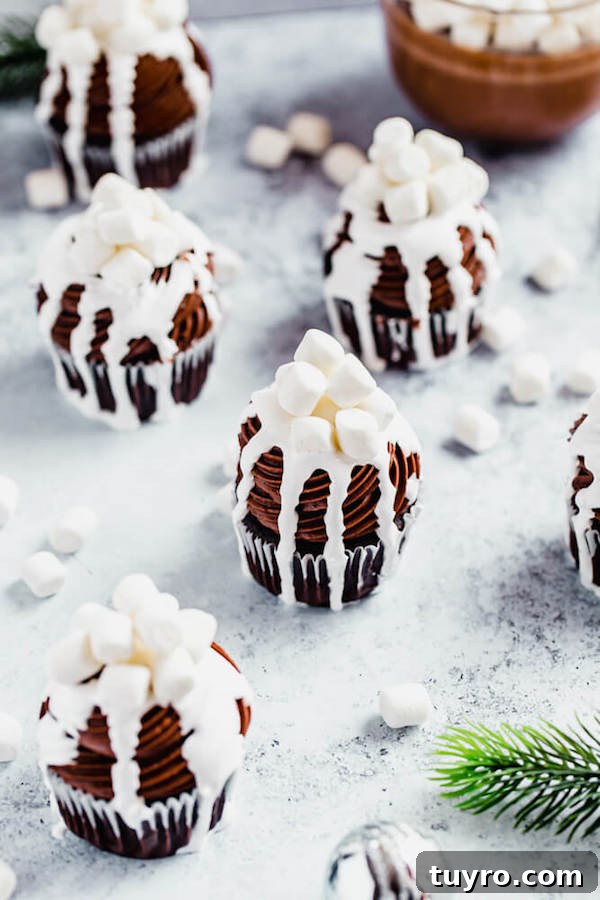 Hot Chocolate Cupcakes with hot chocolate mug hot chocolate cupcakes with a mug of hot chocolate in the back