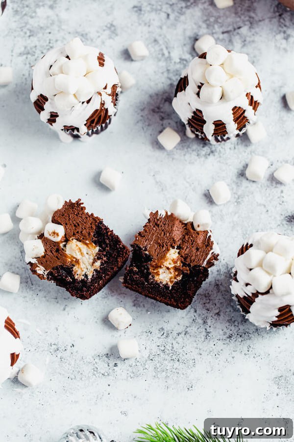 Hot Chocolate Cupcake cross-section hot chocolate cupcake cut in half with marshmallow filling