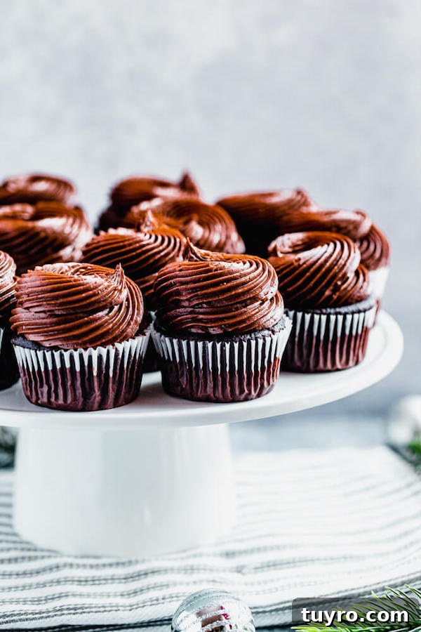 Chocolate Buttercream swirls on cupcakes chocolate cupcakes on a cake stand