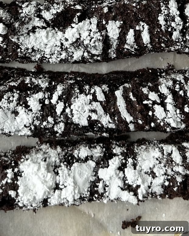 No-Roll Fudgy Passover Crinkle Cookie Sticks Recipe 3 Sliced crinkle cookie sticks on a board