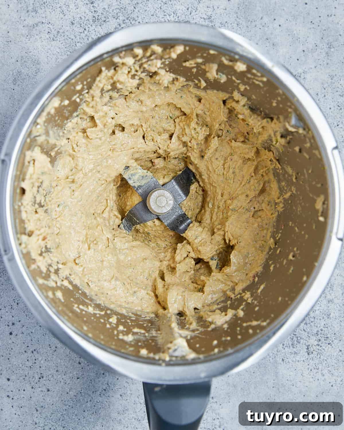Vegan Whipped Feta Dip with Pistachios Lime Leaves and Rosemary 7 Overhead photo showing the food processor with the whizzed up vegan feta dip inside.