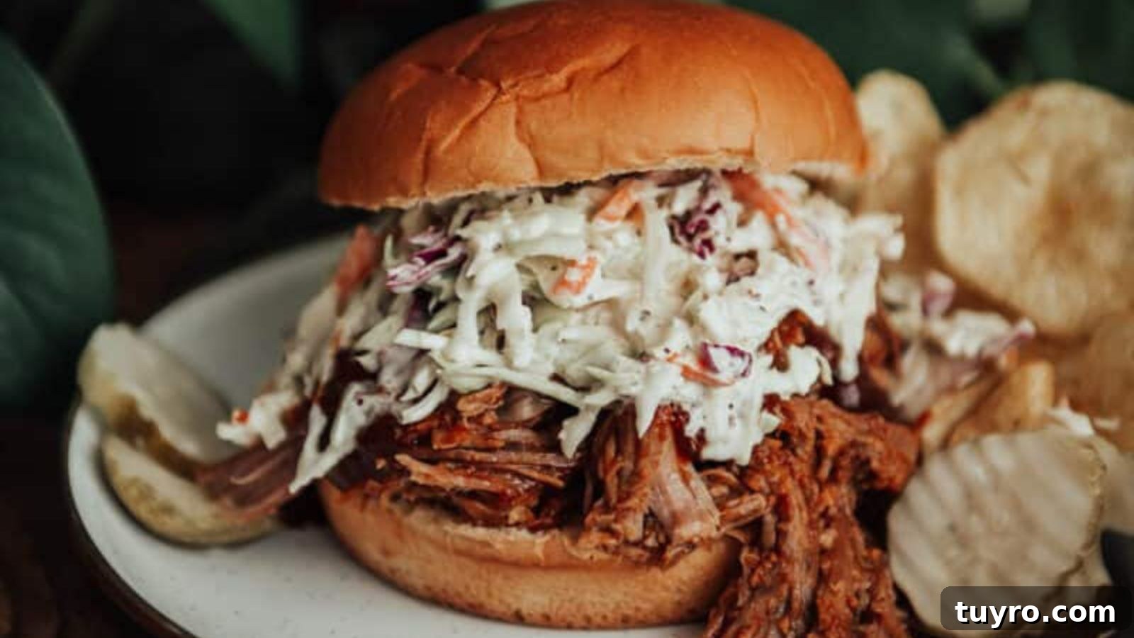Pulled pork slow cooked until it shreds easily for sandwiches or tacos.