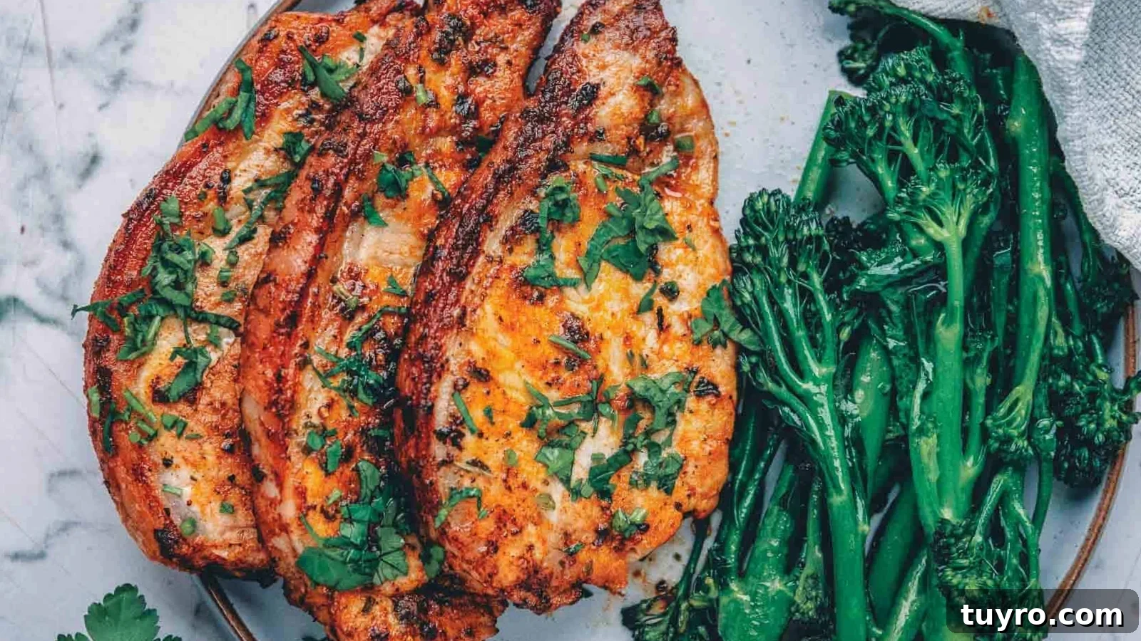 Air fryer pork chops with a browned crust and tender center.