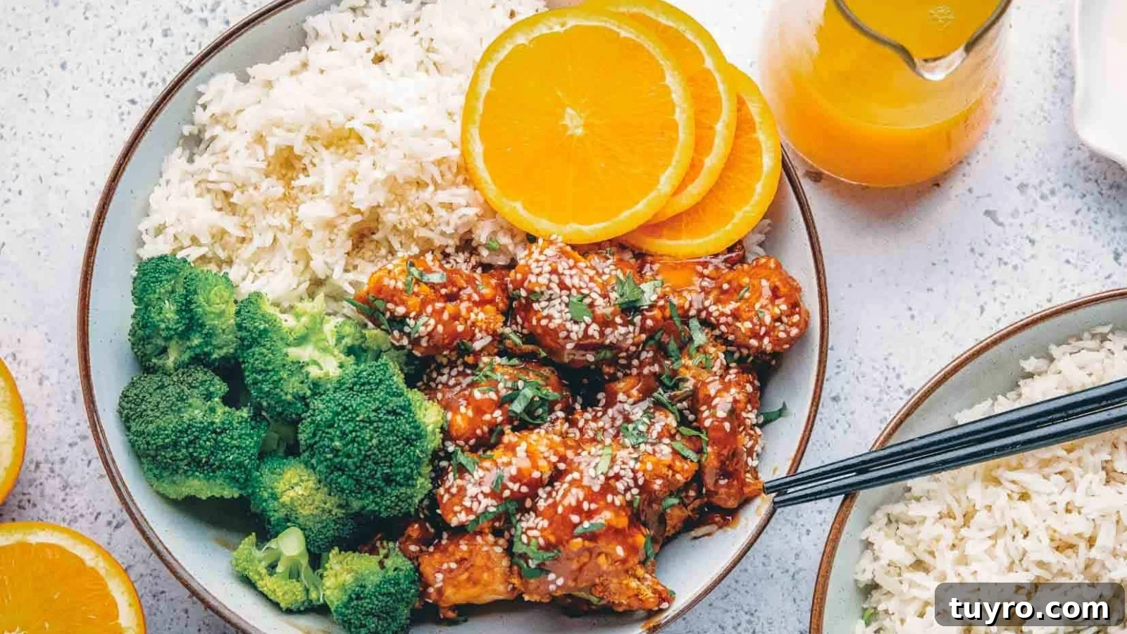 Air fryer orange chicken coated in a sweet, lightly spicy glaze.