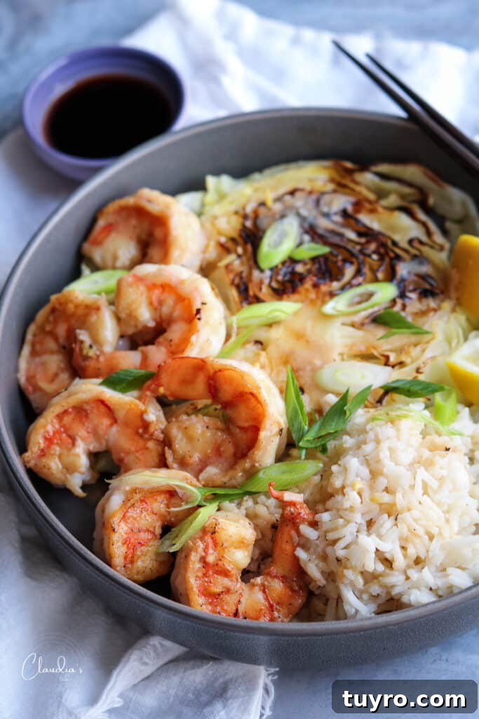 Miso Butter Shrimp Recipe: Savory Glazed Shrimp in 20 Minutes 5 Miso butter shrimp served with charred cabbage and steamed rice.