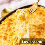 Korean-Style Cheese Corn Recipe — Creamy Corn with Mozzarella 7 Picking up some Korean corn cheese with a fork.