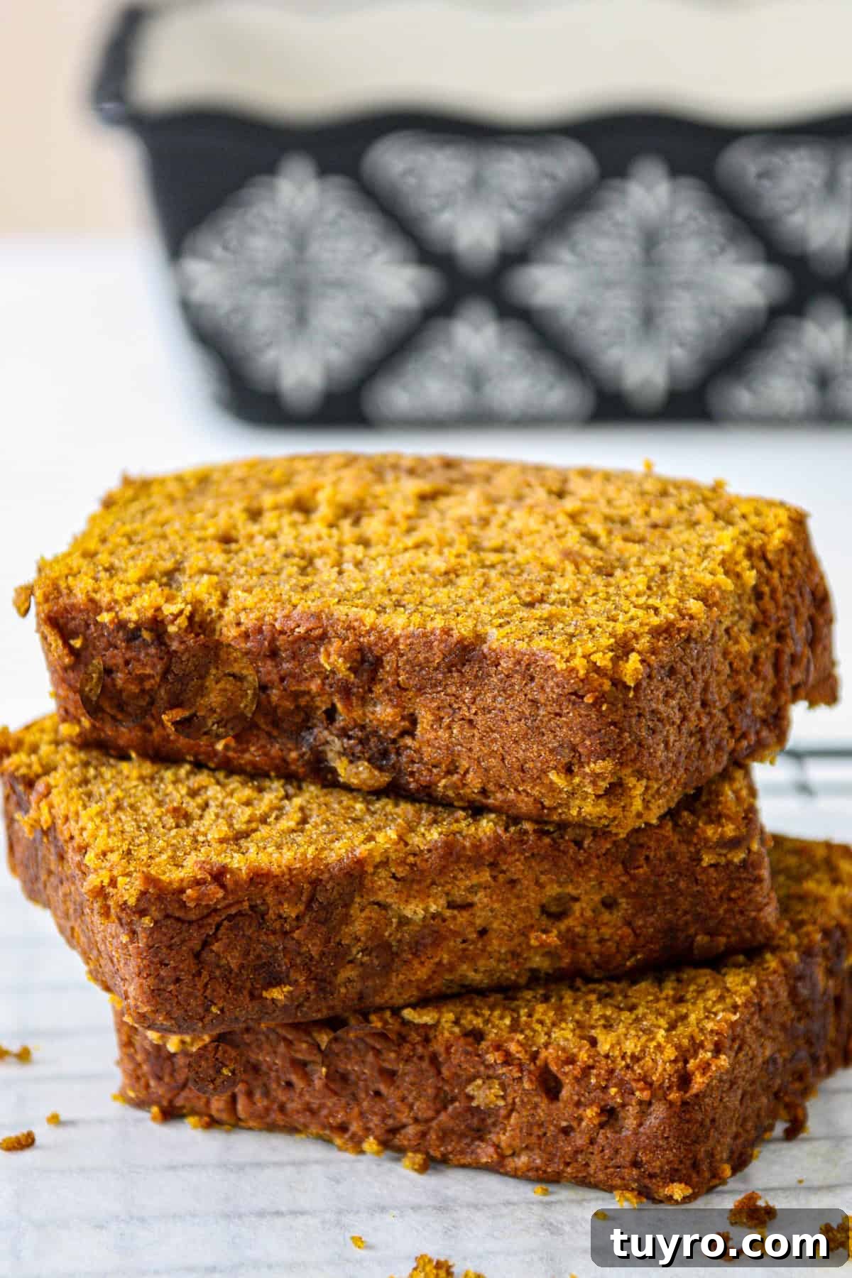 Gluten Free Pumpkin Bread Recipe 3 A stack of three slices of gluten free pumpkin bread.