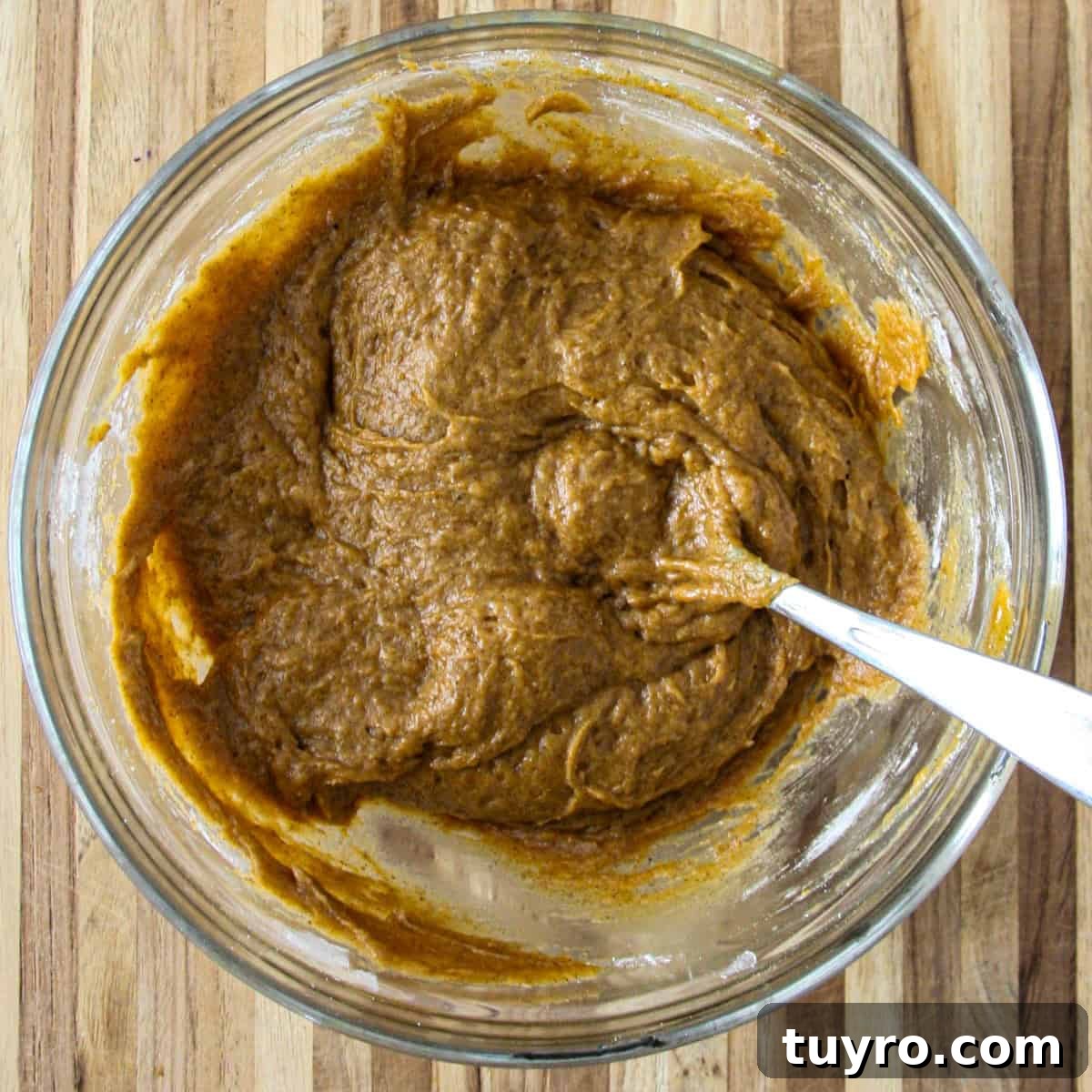 Gluten Free Pumpkin Bread Recipe 7 The finished batter for the pumpkin loaf in a glass bowl.