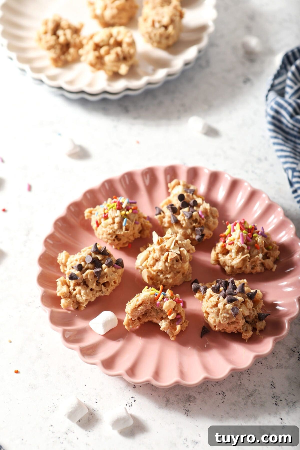 No-Bake Avalanche Cookies Recipe: No-Oven Snowball Treats 7 Several Avalanche Cookies on a pink plate on a marble backdrop