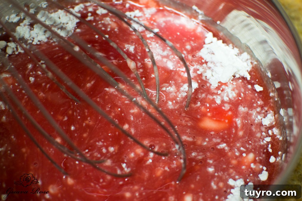 Whisking cornstarch into guava juice concentrate