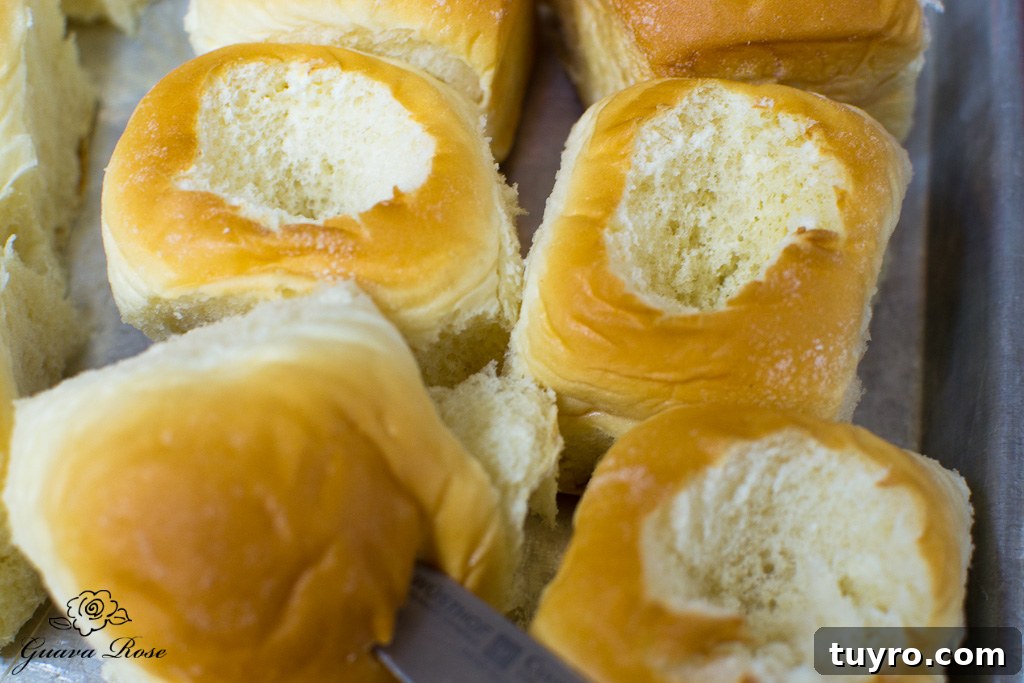 Cutting out centers of Hawaiian sweet rolls