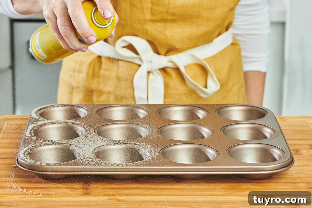 Oven-Baked Eggs: Simple Methods for Perfect Results 3 Woman spraying muffin tin with cooking spray.
