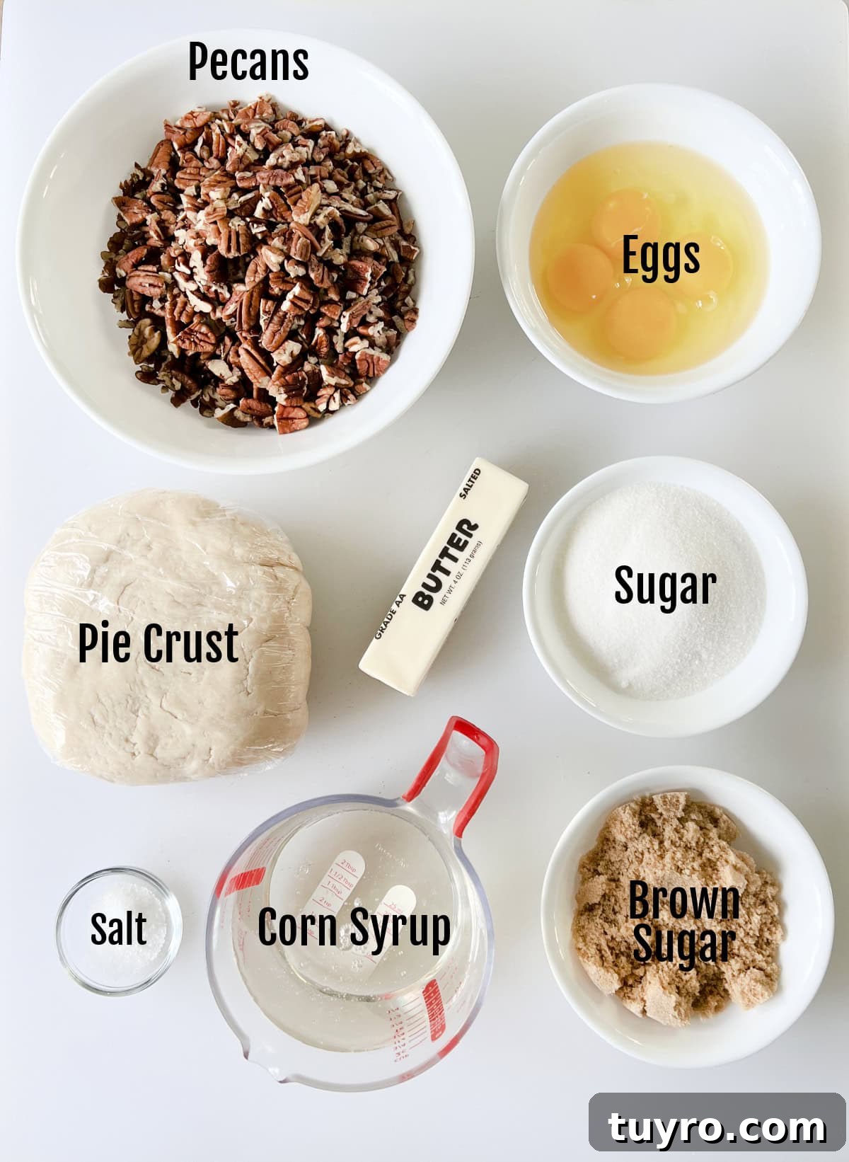 Sheet Pan Pecan Slab Pie Recipe 3 Bowls of pecan halves, eggs, stick of butter, sugar, brown sugar, salt, corn syrup and pie crust.