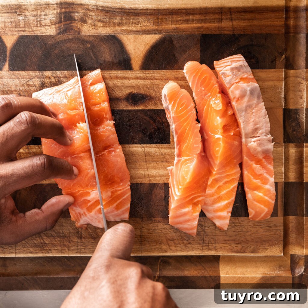 slicing salmon into strips