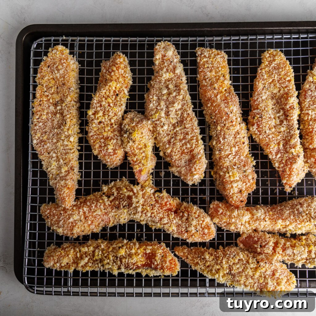 panko coated salmon fish sticks on a wire rack