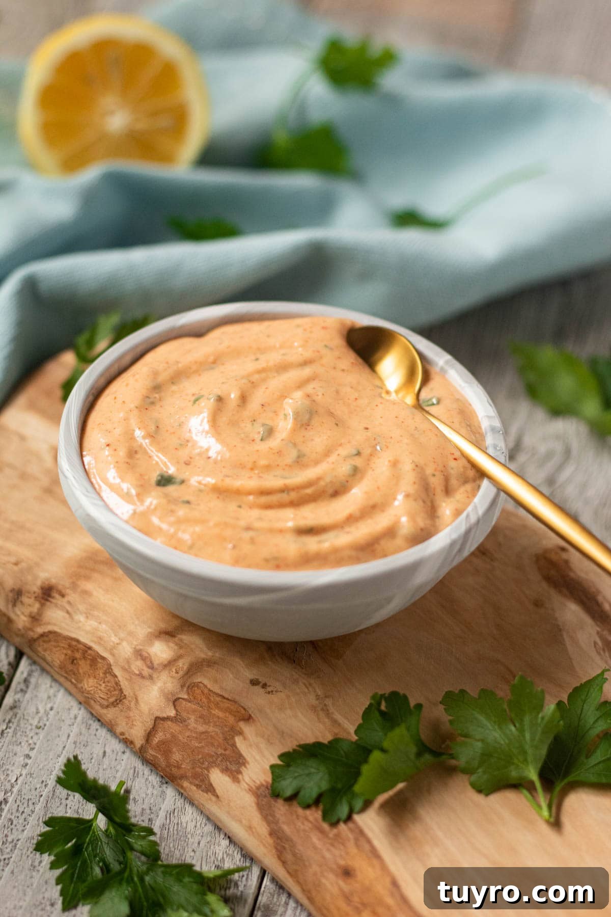 side shot of New Orleans remoulade sauce in a gray bowl.