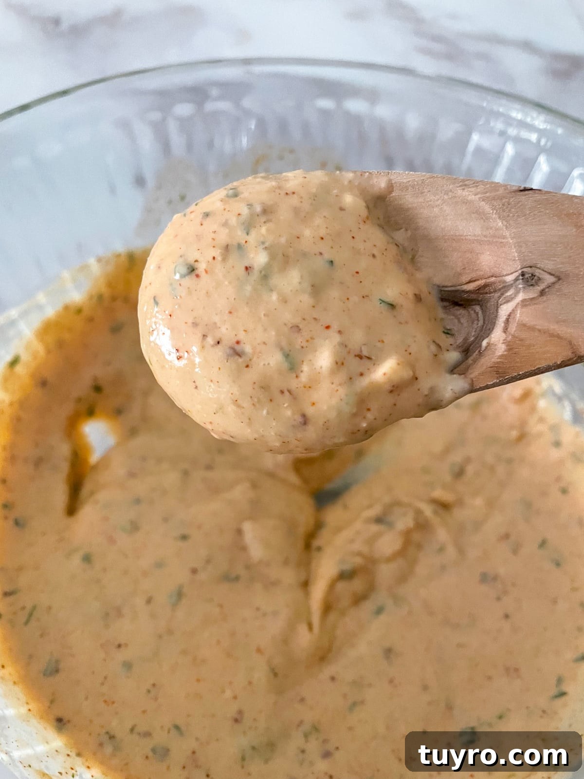 New Orleans remoulade sauce on a wooden spoon.