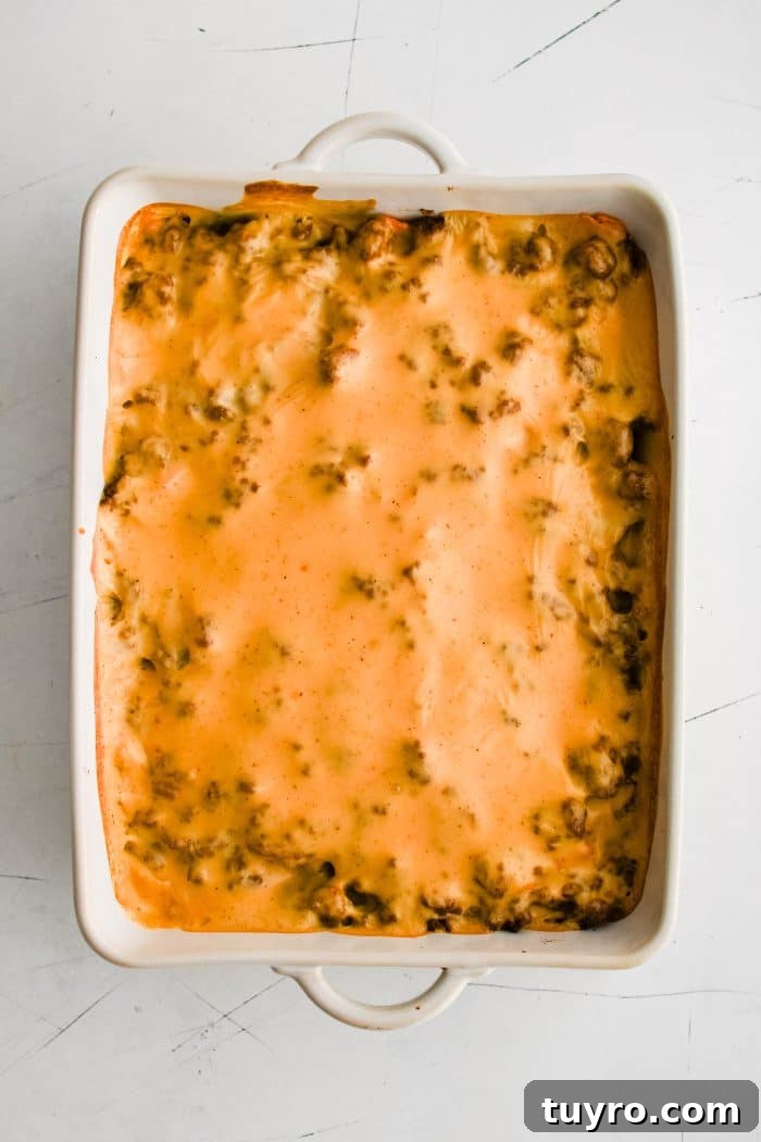 Baked walking taco casserole in a large 9x13-inch baking dish without any toppings.