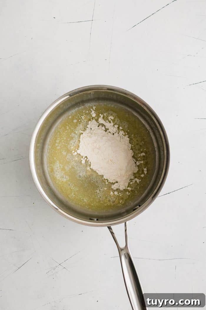 Small sauce pot filled with melted butter and raw flour.