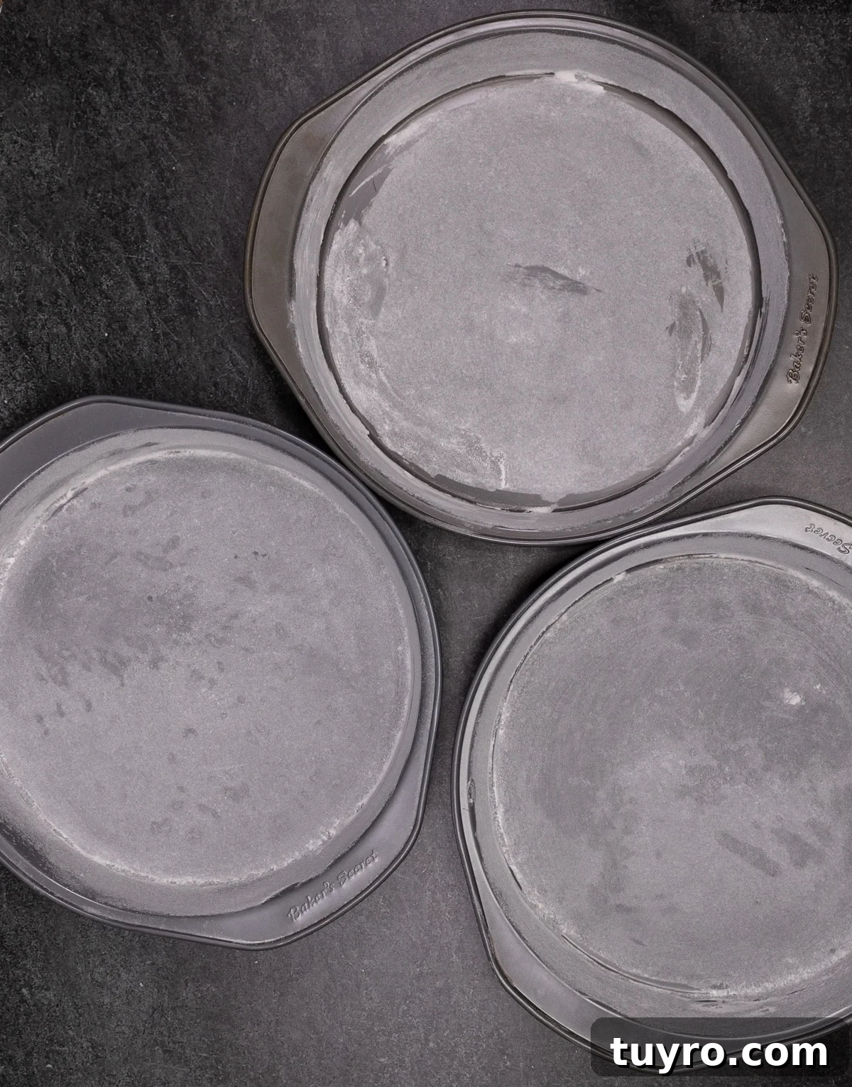Classic Red Velvet Cake with Cream Cheese Frosting 9 3 cake cans covered in butter and flour.