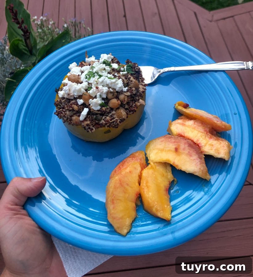stuffed pepper and peach on a plate