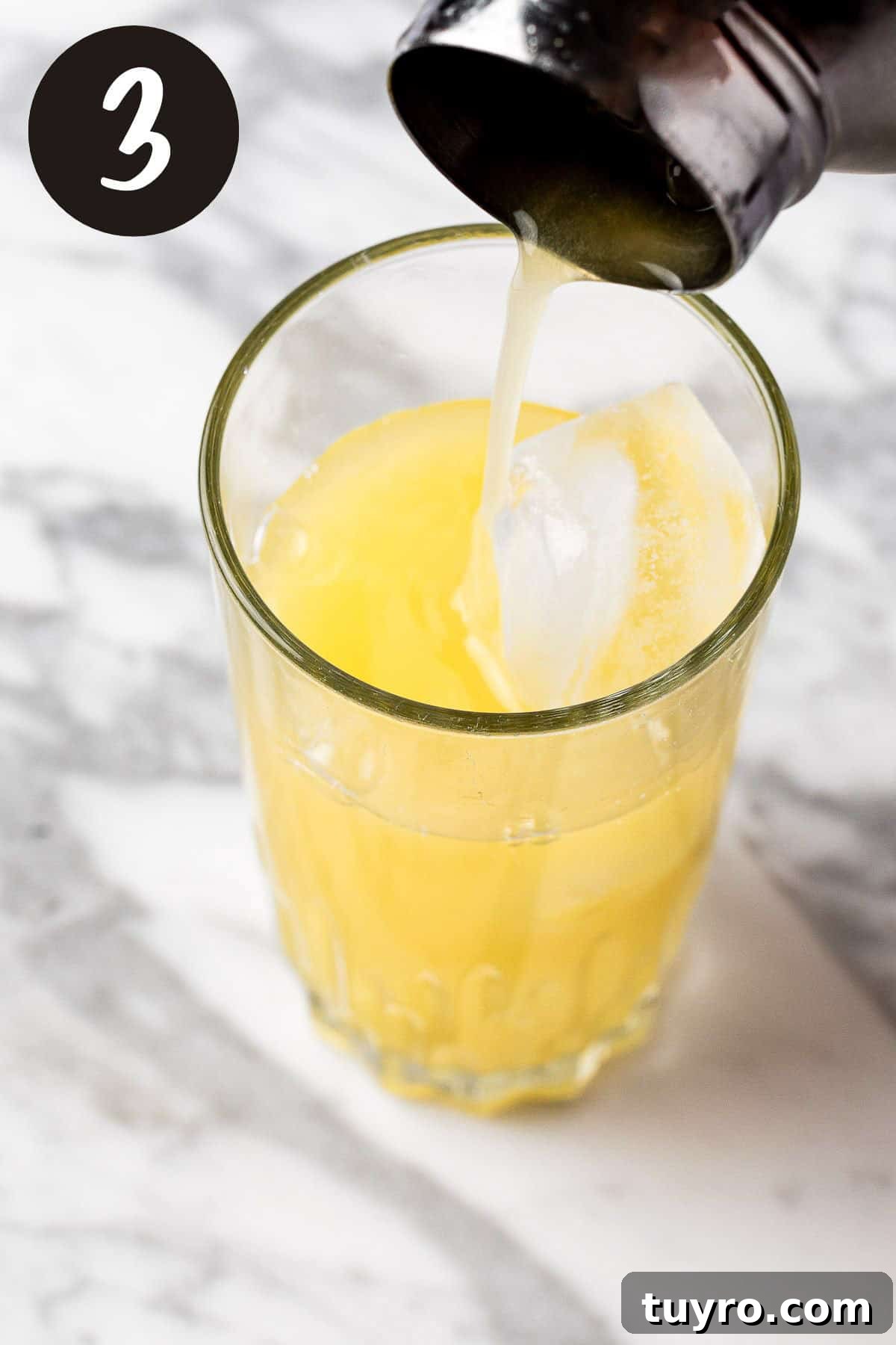 Creamy Banana Rum Cocktail Recipe 6 A process photo illustrating step 3.