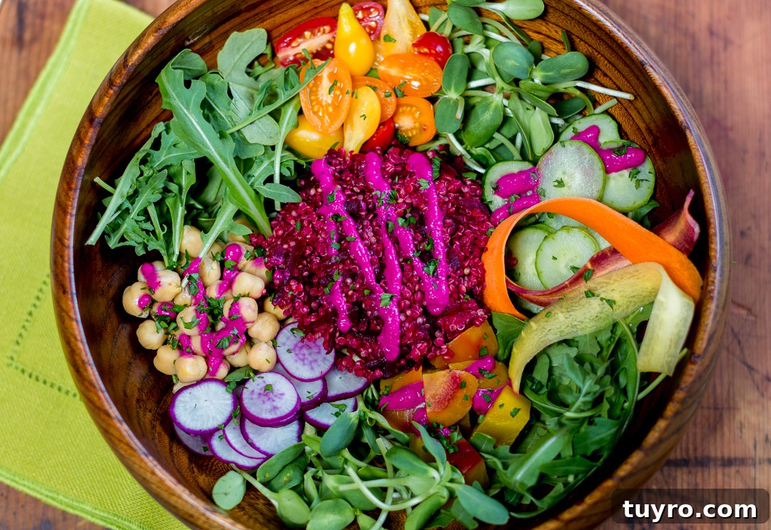 Colorful healthy Buddha bowl with grains, vegetables, protein, and dressing