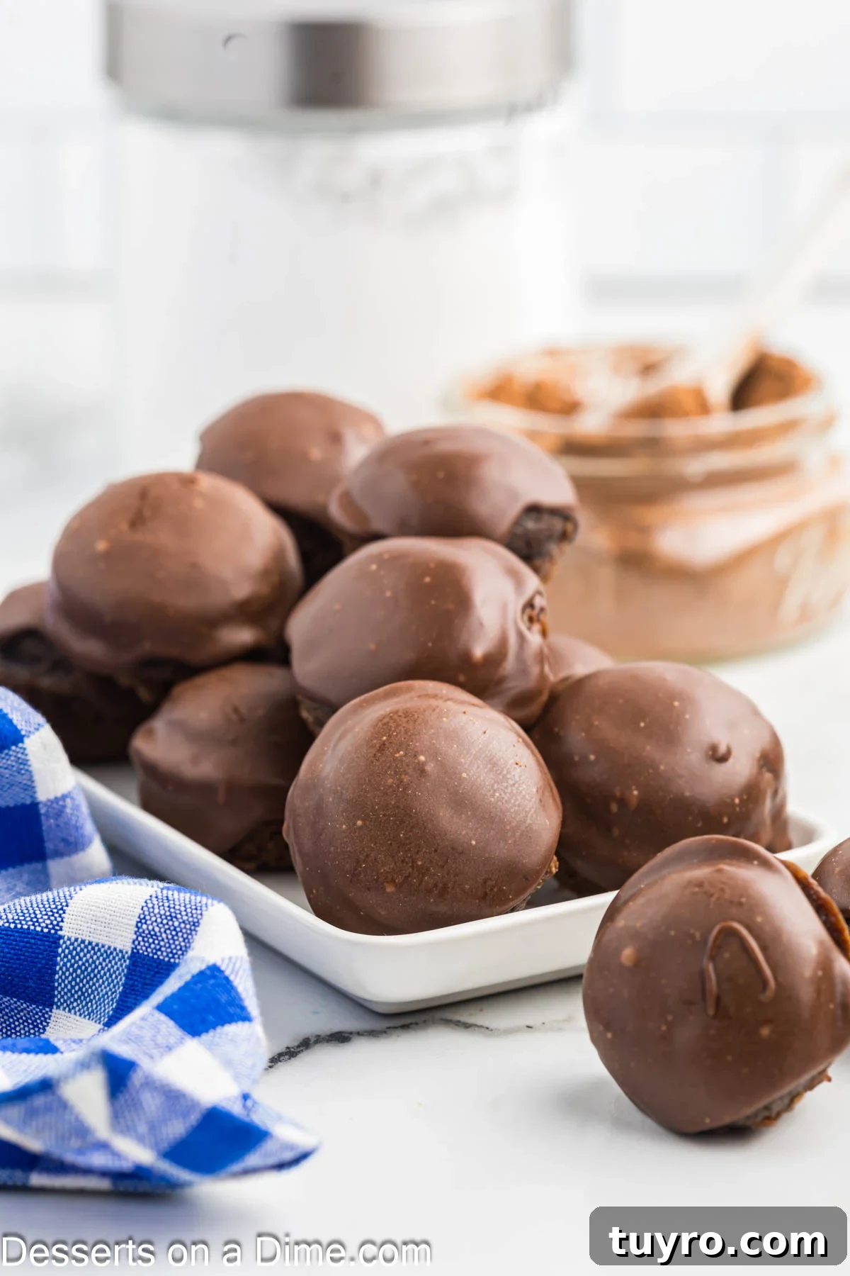 Mini Texas Sheet Cake Bites Recipe — Perfect Chocolate Party Treat 12 Cake bites on a platter.
