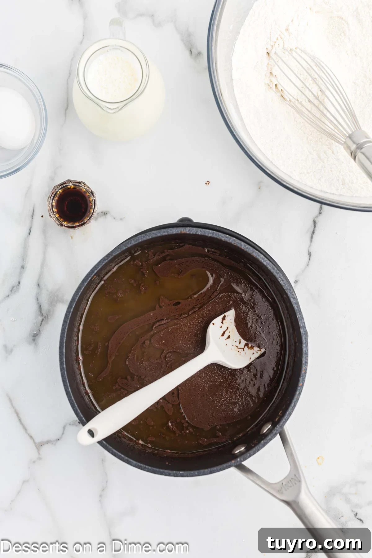 Mini Texas Sheet Cake Bites Recipe — Perfect Chocolate Party Treat 4 Saucepan with cocoa powder mixture.