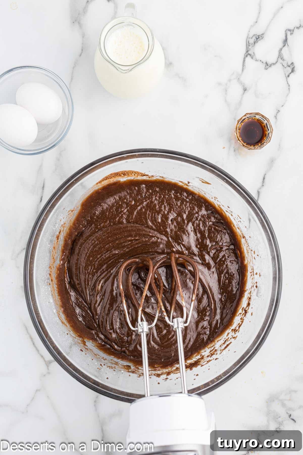 Mini Texas Sheet Cake Bites Recipe — Perfect Chocolate Party Treat 5 Wet and dry ingredients combined in a bowl.