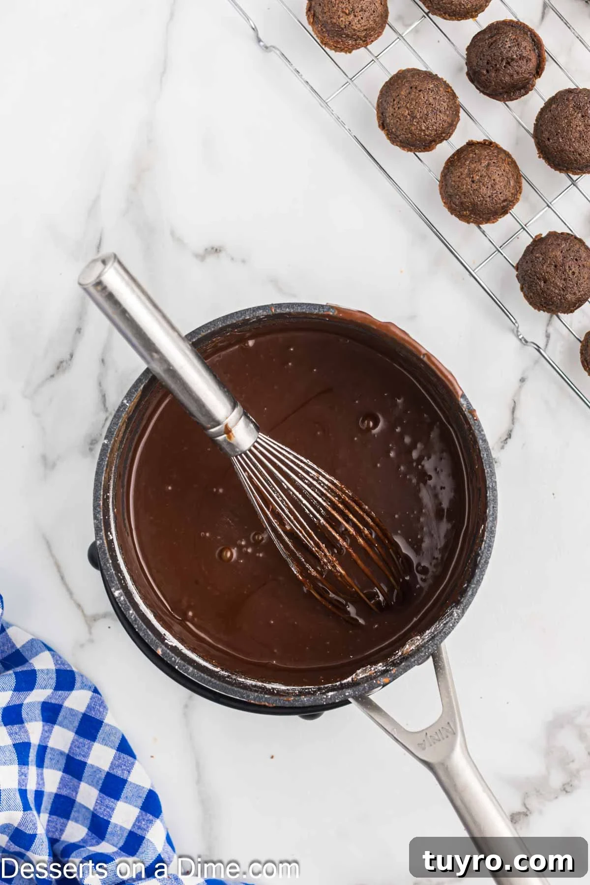 Mini Texas Sheet Cake Bites Recipe — Perfect Chocolate Party Treat 9 Frosting mixture in saucepan.