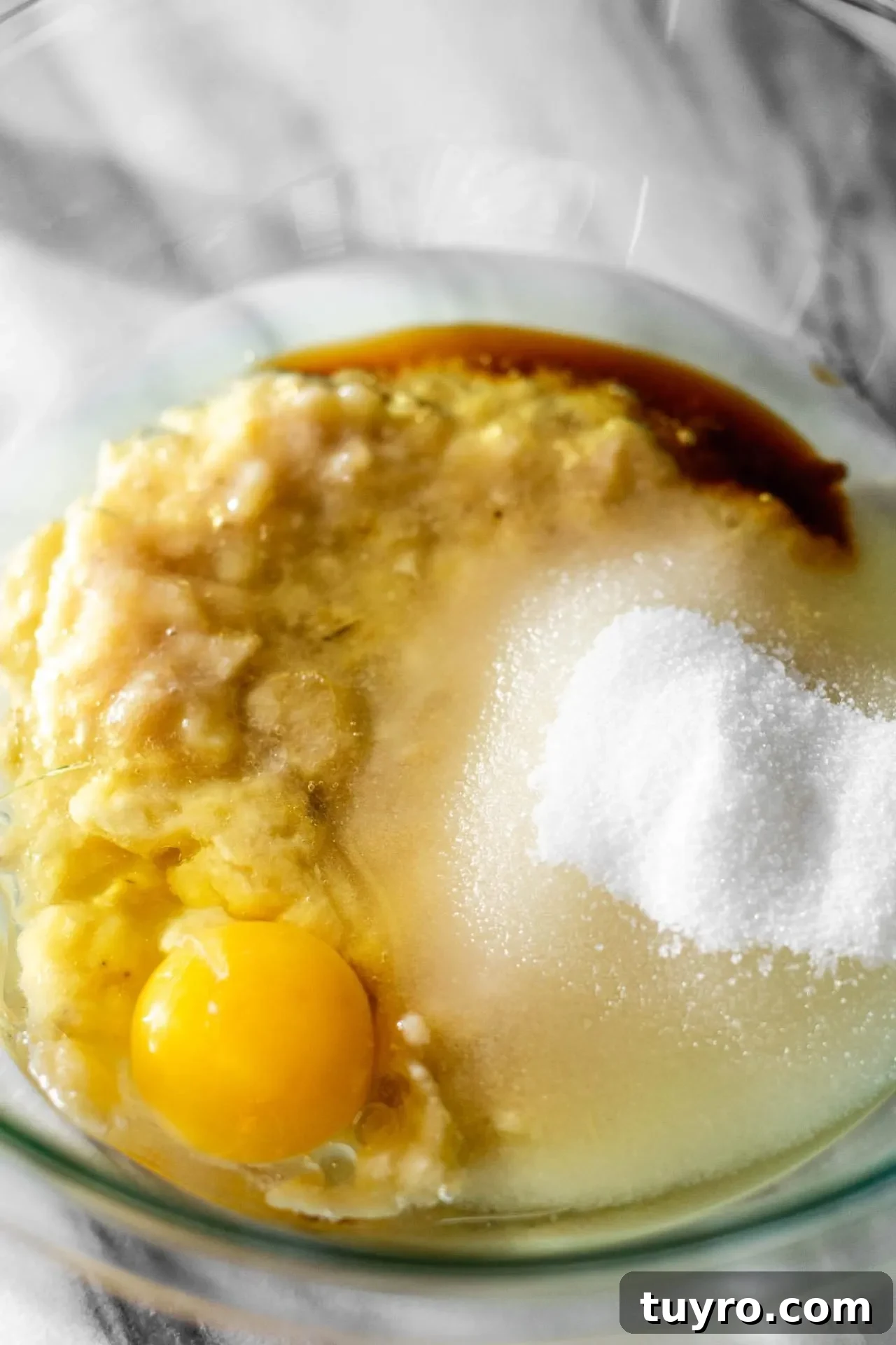 banana muffin batter wet ingredients combined in a bowl