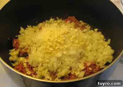 Spaghetti with Classic Greek Meat Sauce (Makaronia me Kima) 3 Saute onions and beef for greek recipe makaronia me kima, greek spaghetti with meat sauce.