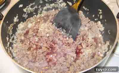 Spaghetti with Classic Greek Meat Sauce (Makaronia me Kima) 6 Simmering the beef in wine for greek recipe makaronia me kima, greek spaghetti with meat sauce.