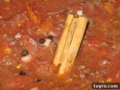 Spaghetti with Classic Greek Meat Sauce (Makaronia me Kima) 9 Add tomato sauce and spices to greek recipe makaronia me kima, greek spaghetti with meat sauce.