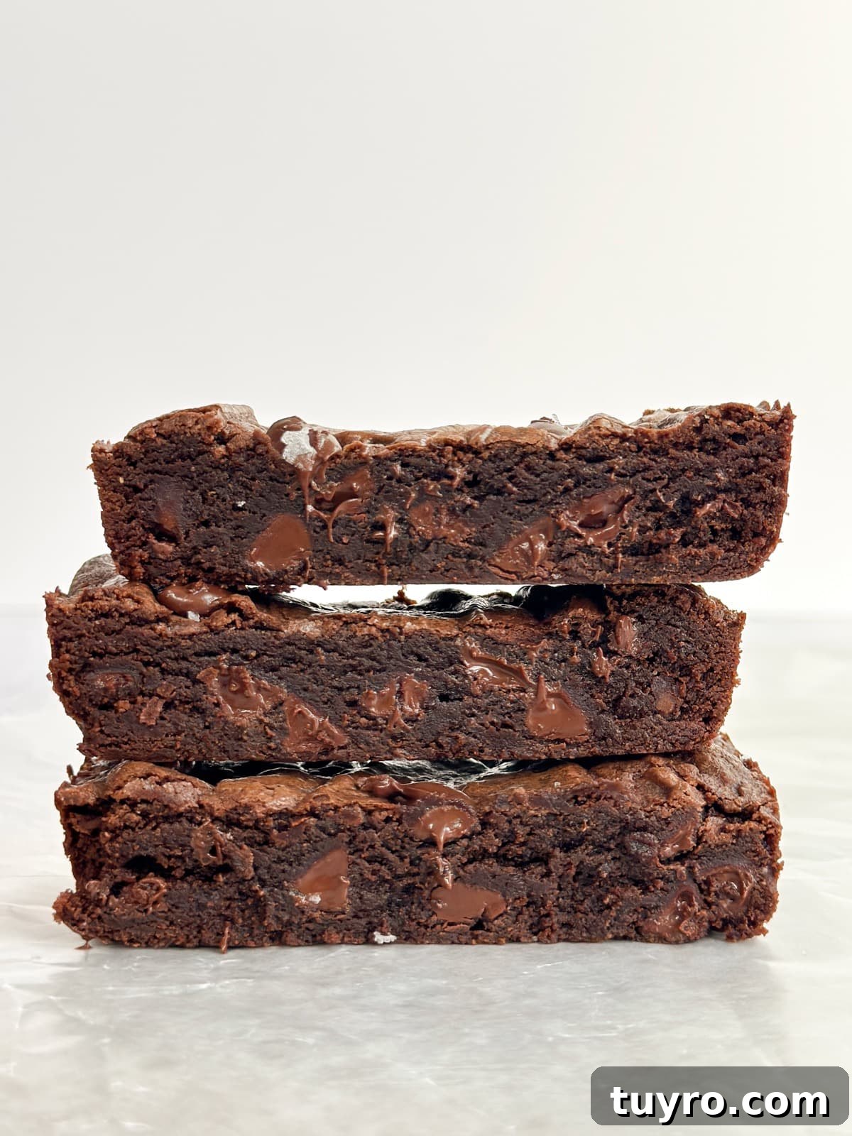small batch brownies stacked on top of each other.